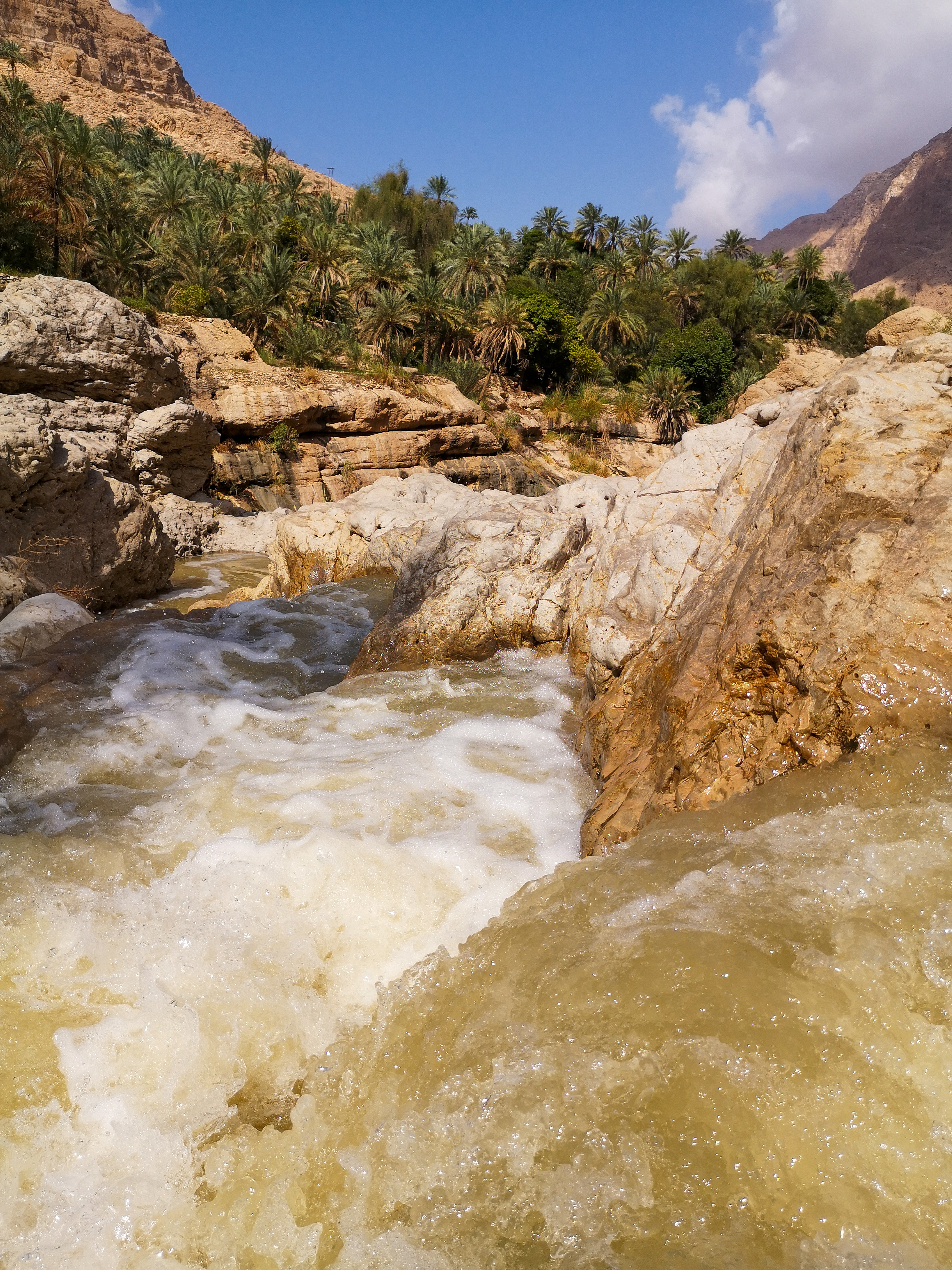 Hiking into the Wadi Tiwi, Oman  Hiking into the Wadi Tiwi, Oman