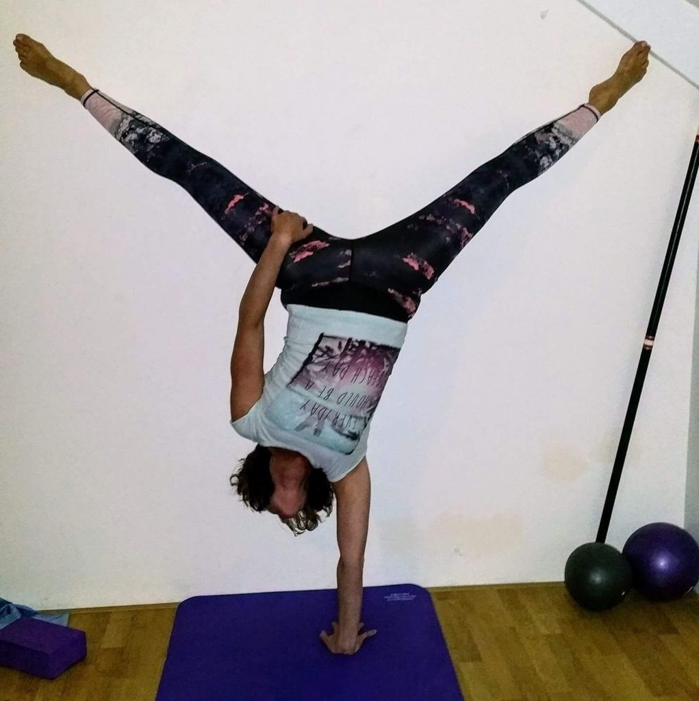 The Handstand is a Must Do! Yoga - Adho Mukha Vrksasana - Safe and Healthy  Travel