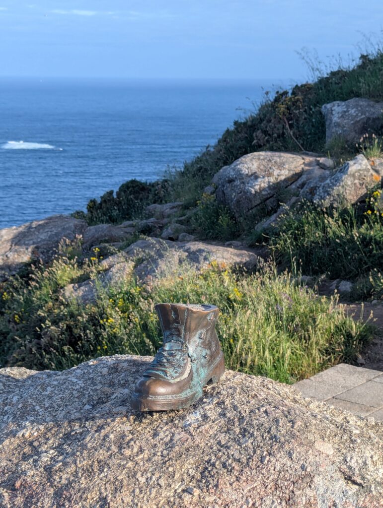 Shoe at end Finisterre - Camino Finisterre Guide