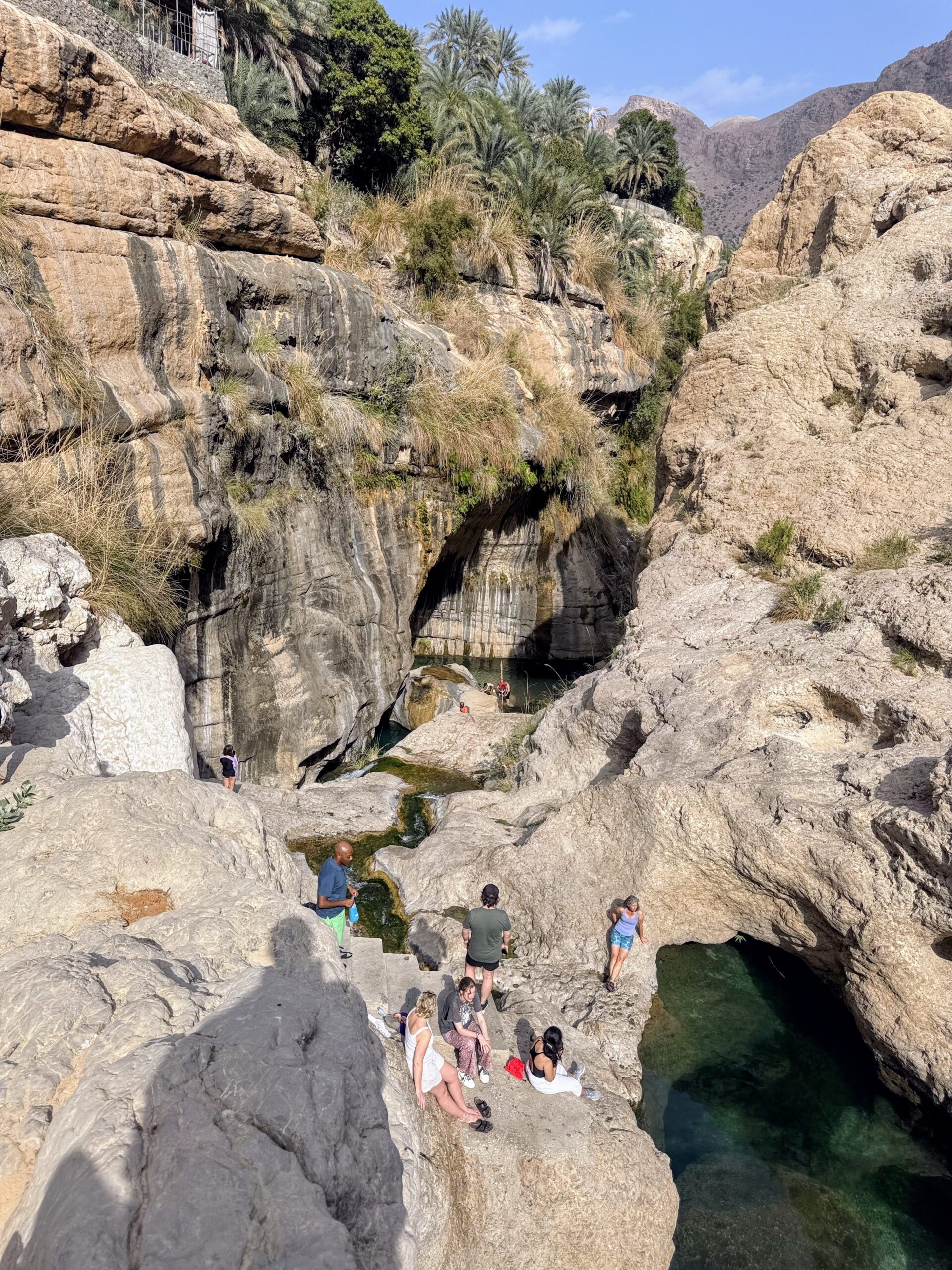 Enjoying the sun in the Wadi Tiwi just before ascending by rope into the wadi